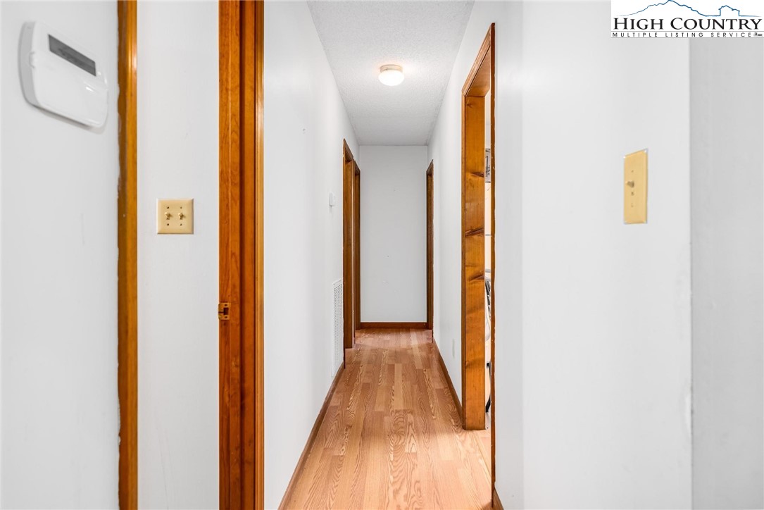 424 Poga Road Butler, TN 37640 - Photo 21 of 40 a view of a hallway with wooden floor