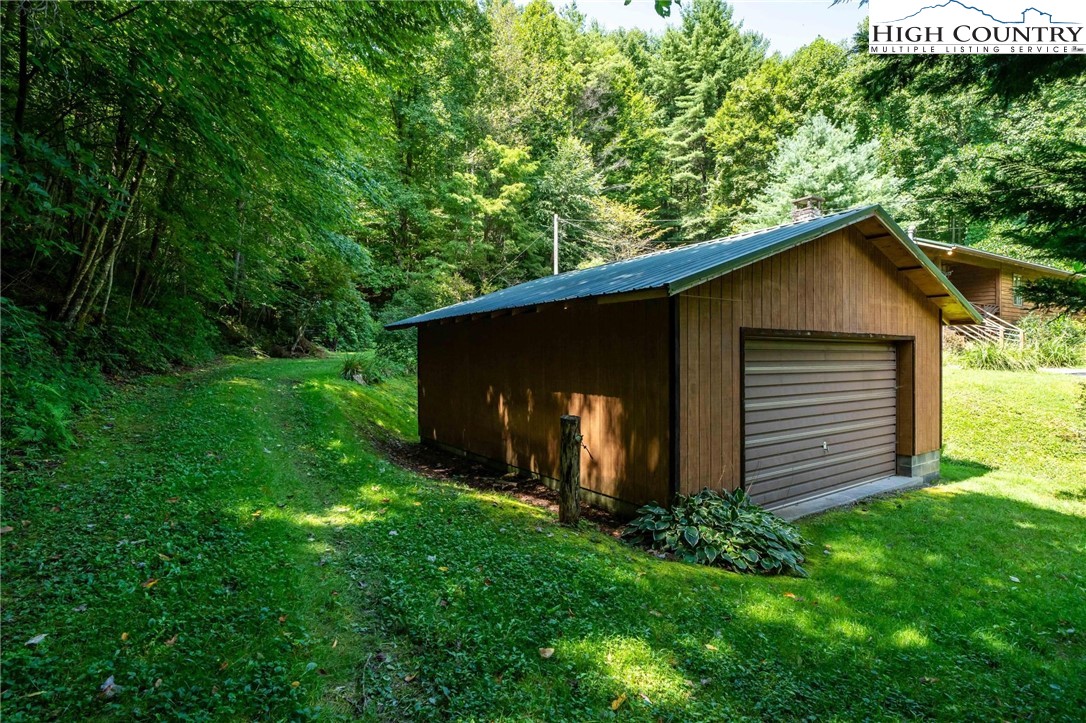 424 Poga Road Butler, TN 37640 - Photo 38 of 40 a view of house with backyard