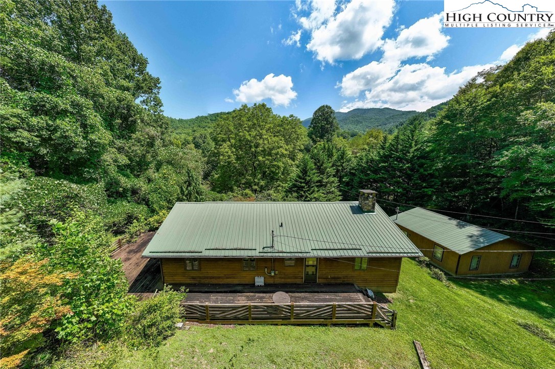 424 Poga Road Butler, TN 37640 - Photo 4 of 40 a aerial view of a house with swimming pool and garden