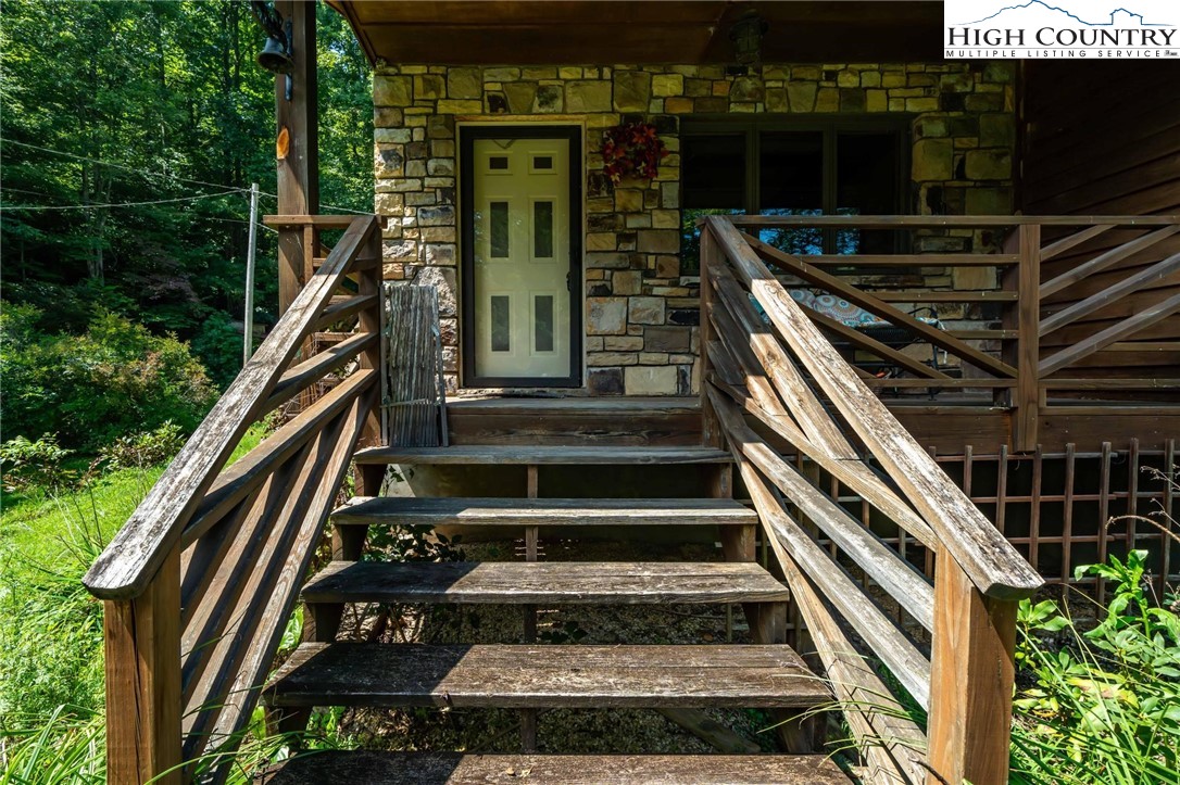 424 Poga Road Butler, TN 37640 - Photo 6 of 40 a front view of a house with a street