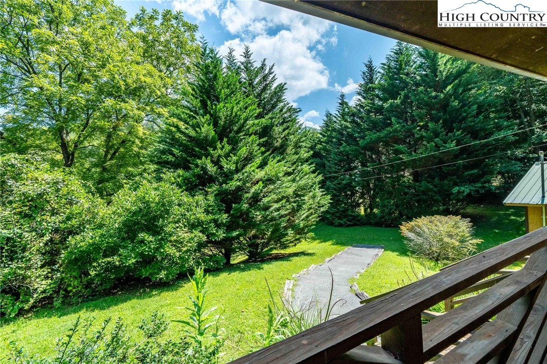 424 Poga Road Butler, TN 37640 - Photo 8 of 40 a view of a garden from a balcony