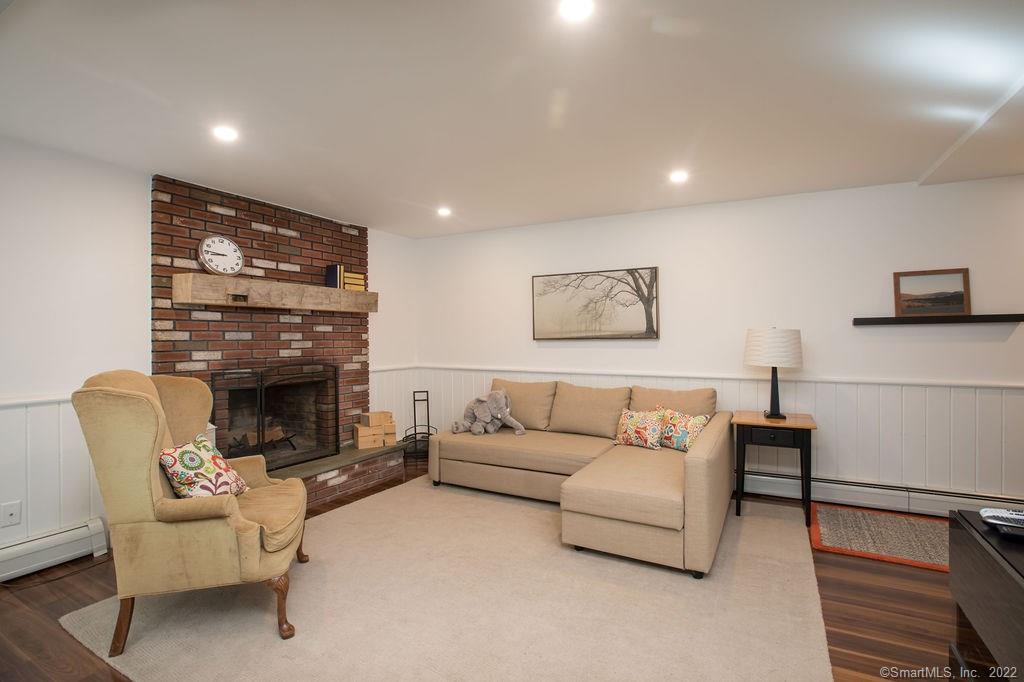 49 Benton Hill Road Sharon, CT 06069 - Photo 13 of 21 a living room with furniture and a fireplace