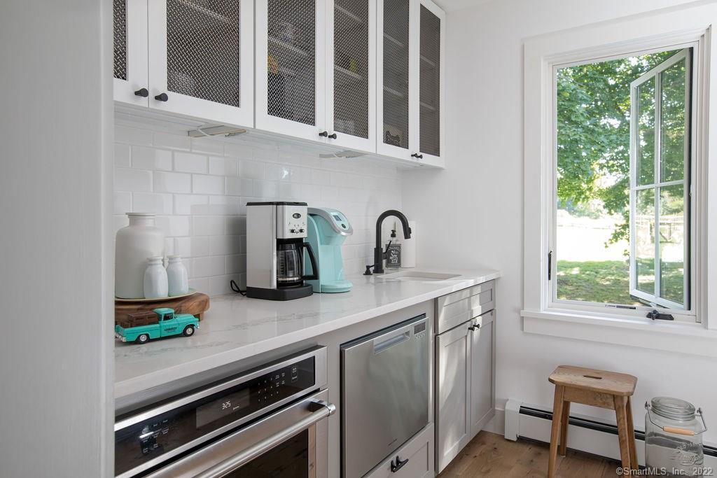 49 Benton Hill Road Sharon, CT 06069 - Photo 15 of 21 a kitchen with stainless steel appliances a sink and a window