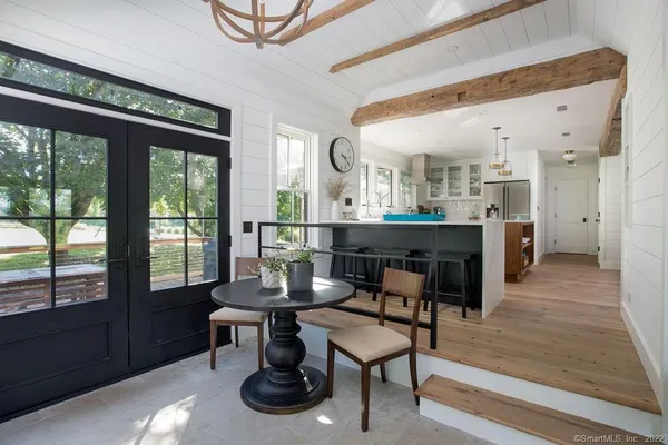 a dining room with furniture and window