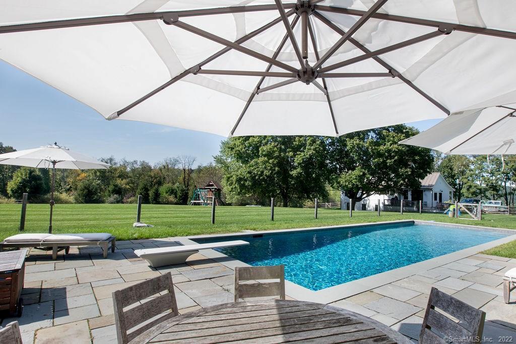 49 Benton Hill Road Sharon, CT 06069 - Photo 7 of 21 a view of a park with a slide and table