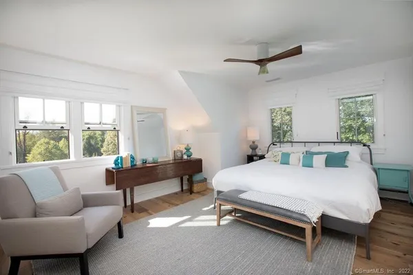 a bedroom with a bed and a couch
