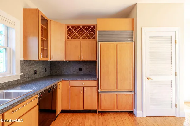 a kitchen with a refrigerator and countertop