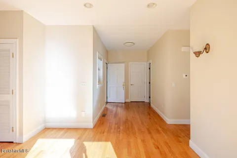a view of a livingroom with wooden floor