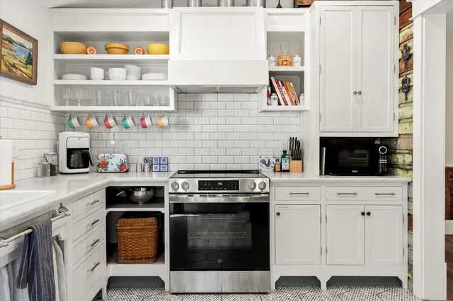 a bedroom with a bed and a bathroom