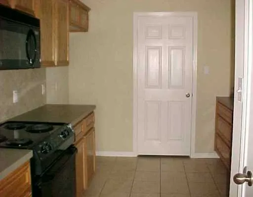 a kitchen with a stove and a microwave