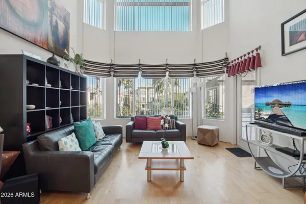 a view of a patio with a table and chairs and potted plants