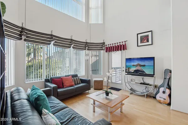a view of a house with pool and sitting area