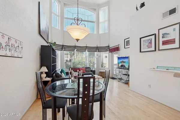 a view of a swimming pool with a table and chairs