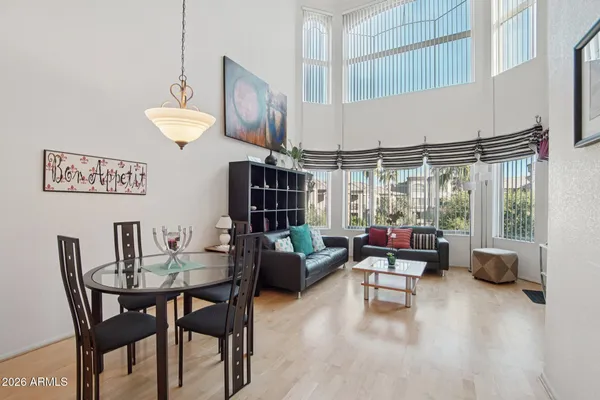 a view of a house with a yard and potted plants