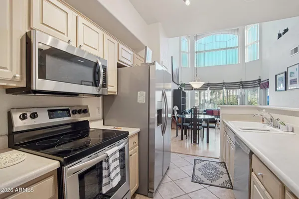 a view of a swimming pool with a patio and plants