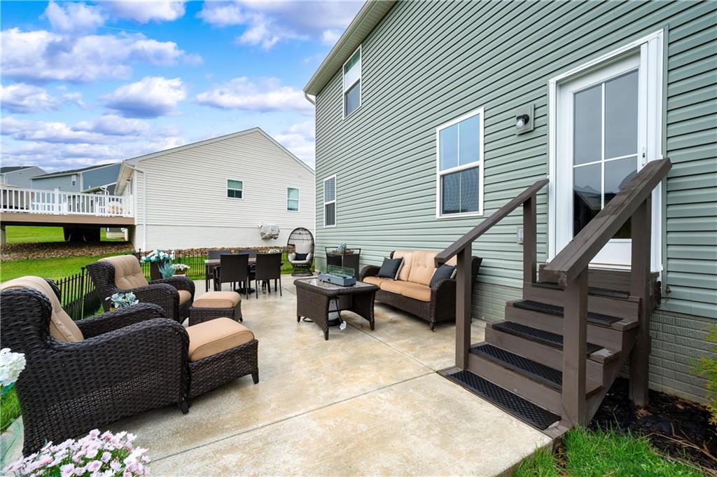 105 Jerome Drive Butler, PA 16001 - Photo 32 of 35 a outdoor living space with patio furniture and a fireplace