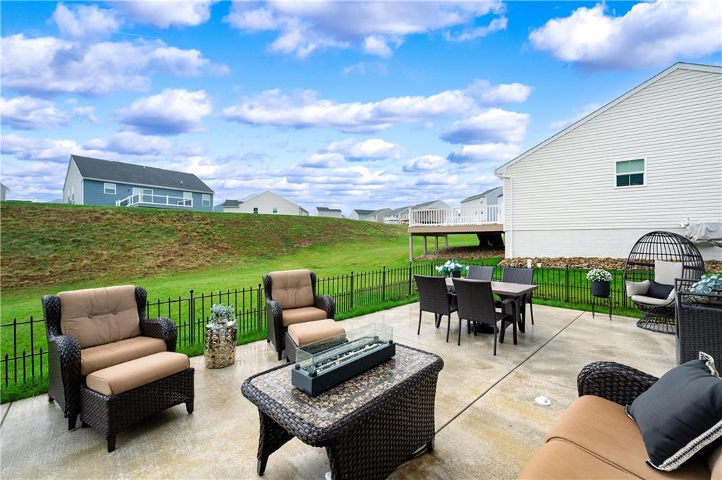 105 Jerome Drive Butler, PA 16001 - Photo 33 of 35 a view of a patio with couches potted plants and a big yard