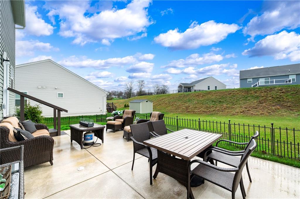 105 Jerome Drive Butler, PA 16001 - Photo 34 of 35 a view of a patio with garden and furniture