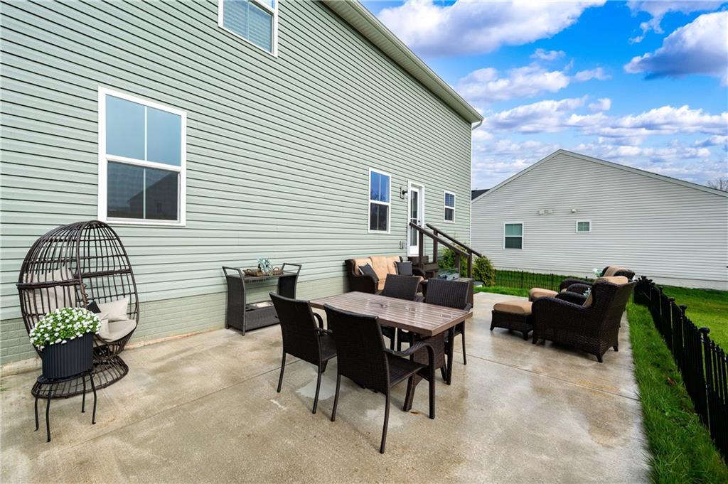 105 Jerome Drive Butler, PA 16001 - Photo 35 of 35 a view of a patio with dining table and chairs