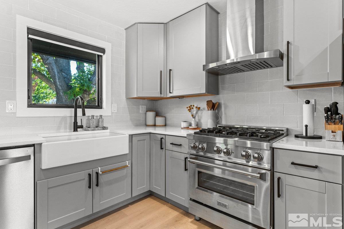 215 Neilson Road Reno, NV 89521 - Photo 11 of 40 a kitchen with appliances cabinets and a sink