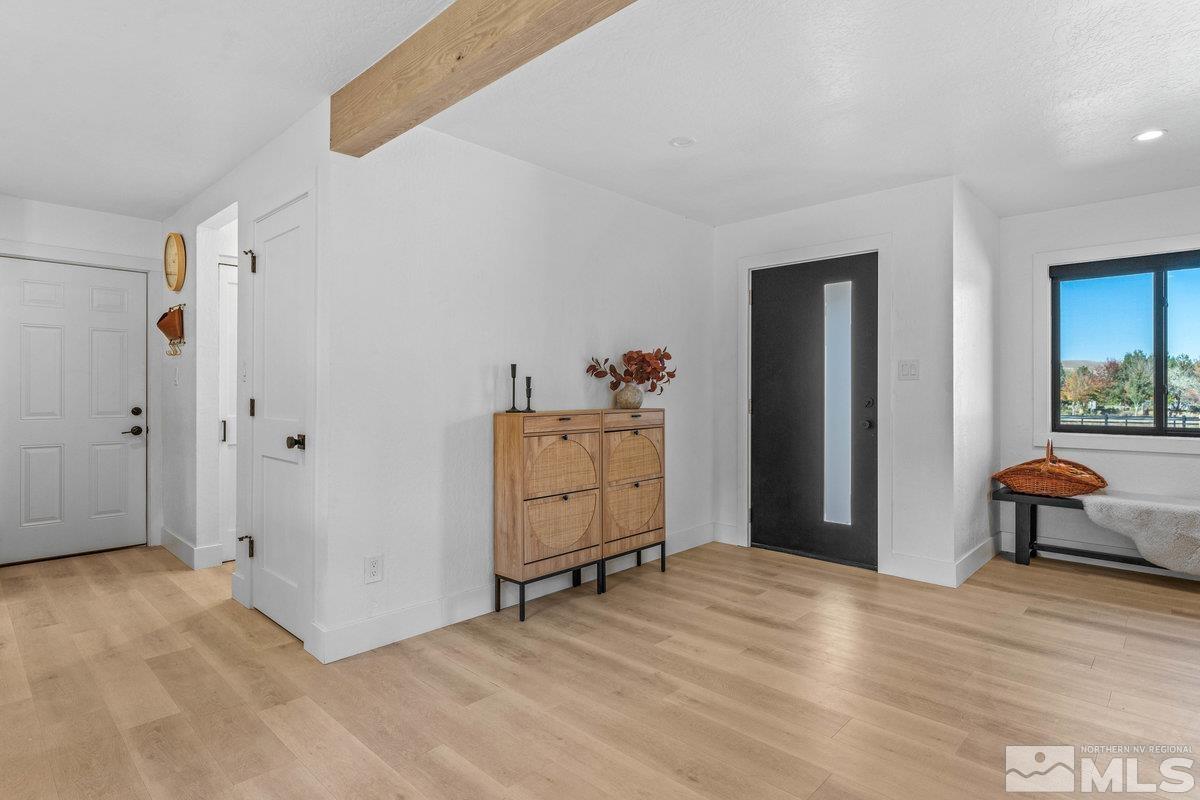 215 Neilson Road Reno, NV 89521 - Photo 13 of 40 a view of a room that has a bed and a chair in it