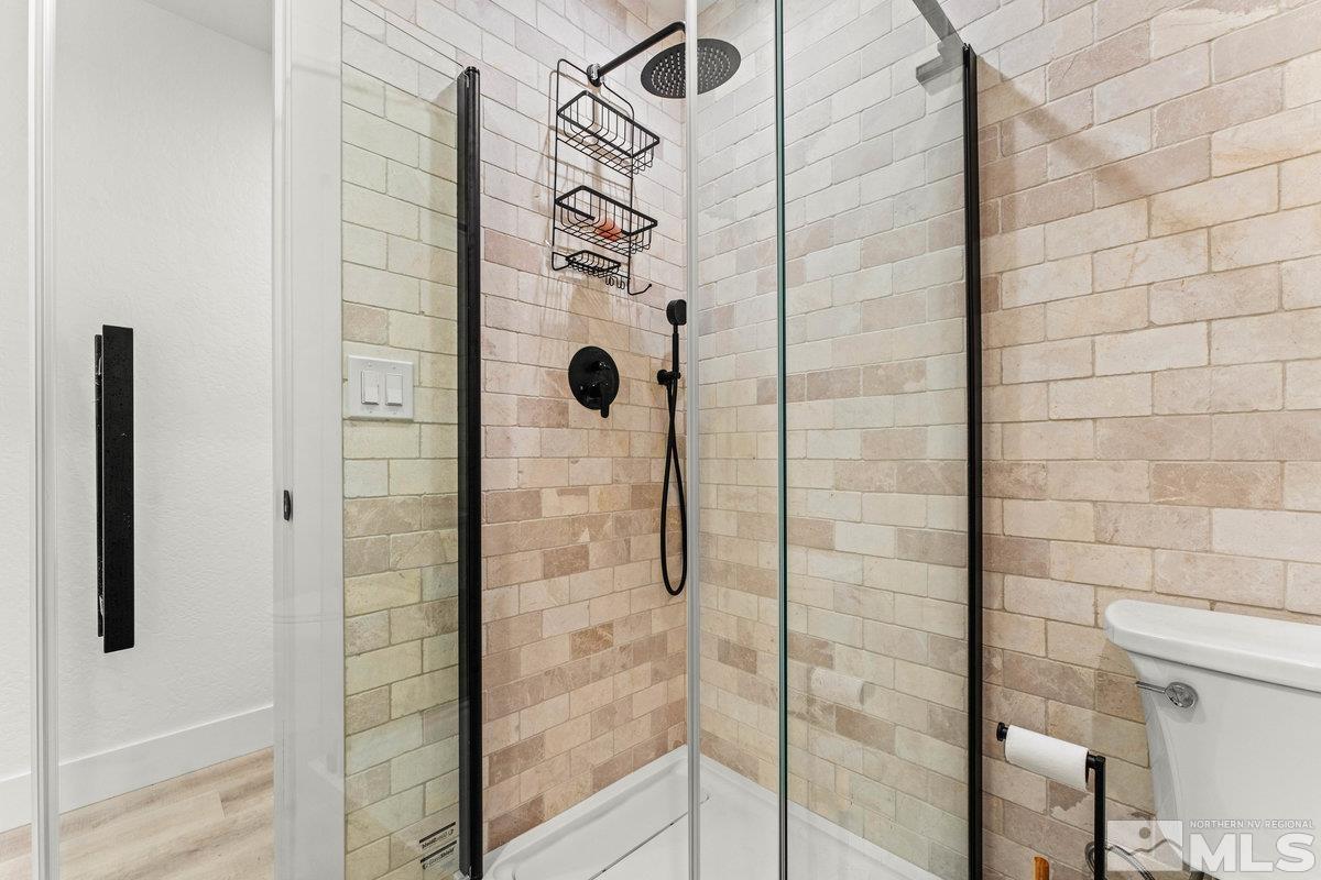 215 Neilson Road Reno, NV 89521 - Photo 14 of 40 a bathroom with a shower