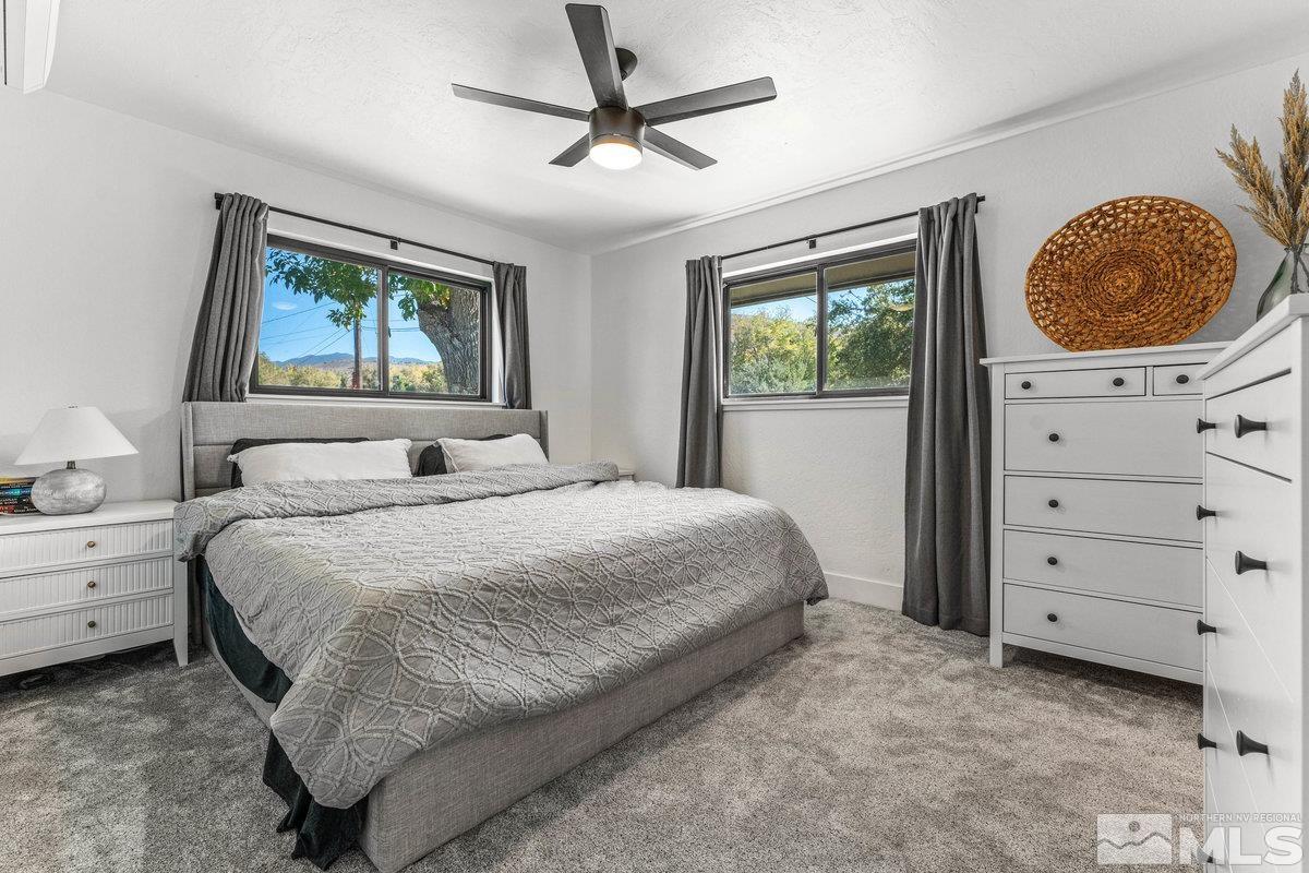 215 Neilson Road Reno, NV 89521 - Photo 15 of 40 a bedroom with a bed and a window