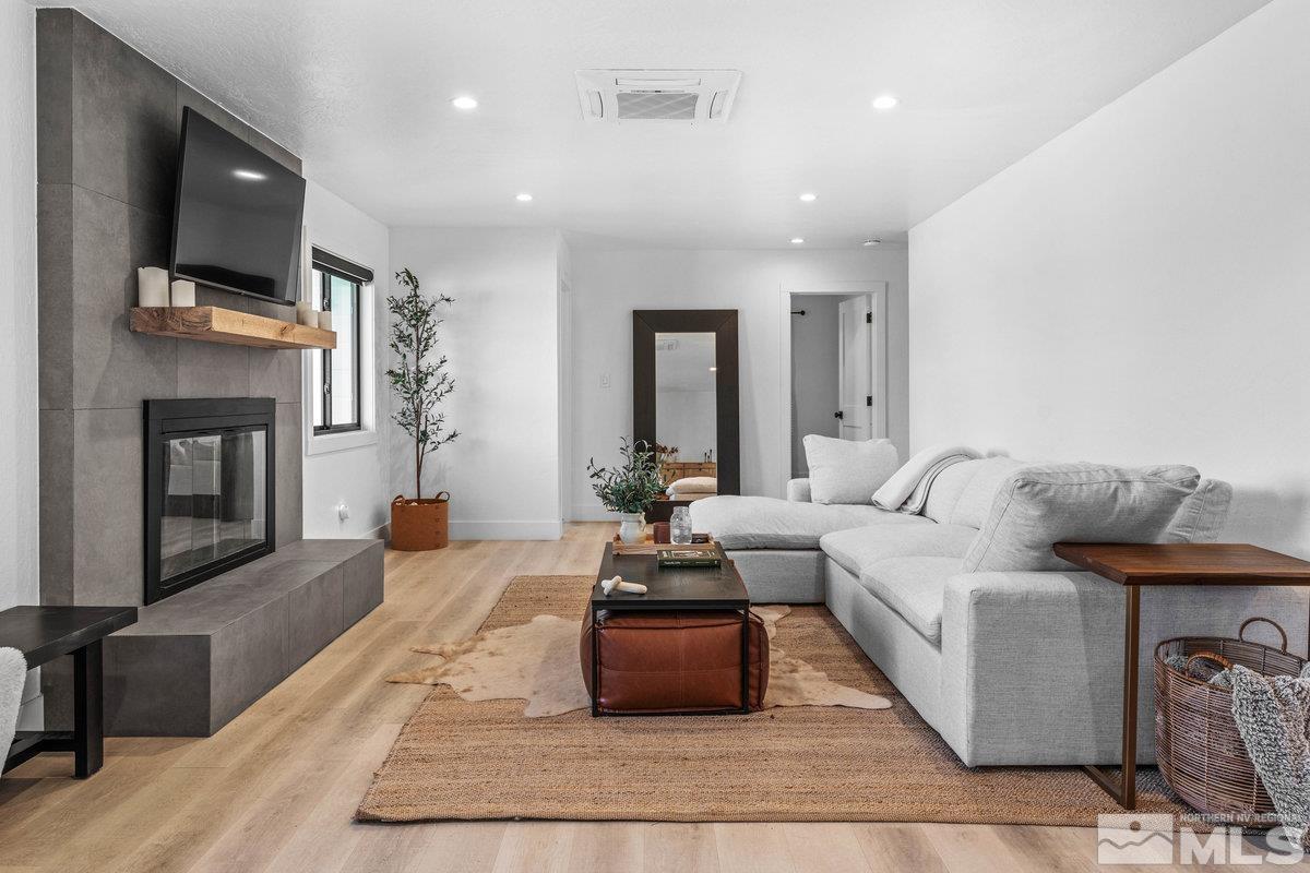 215 Neilson Road Reno, NV 89521 - Photo 2 of 40 a living room with furniture and a flat screen tv