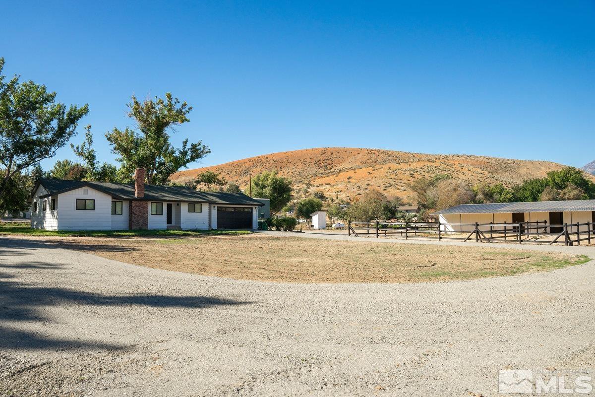 215 Neilson Road Reno, NV 89521 - Photo 25 of 40 a front view of a house with a yard