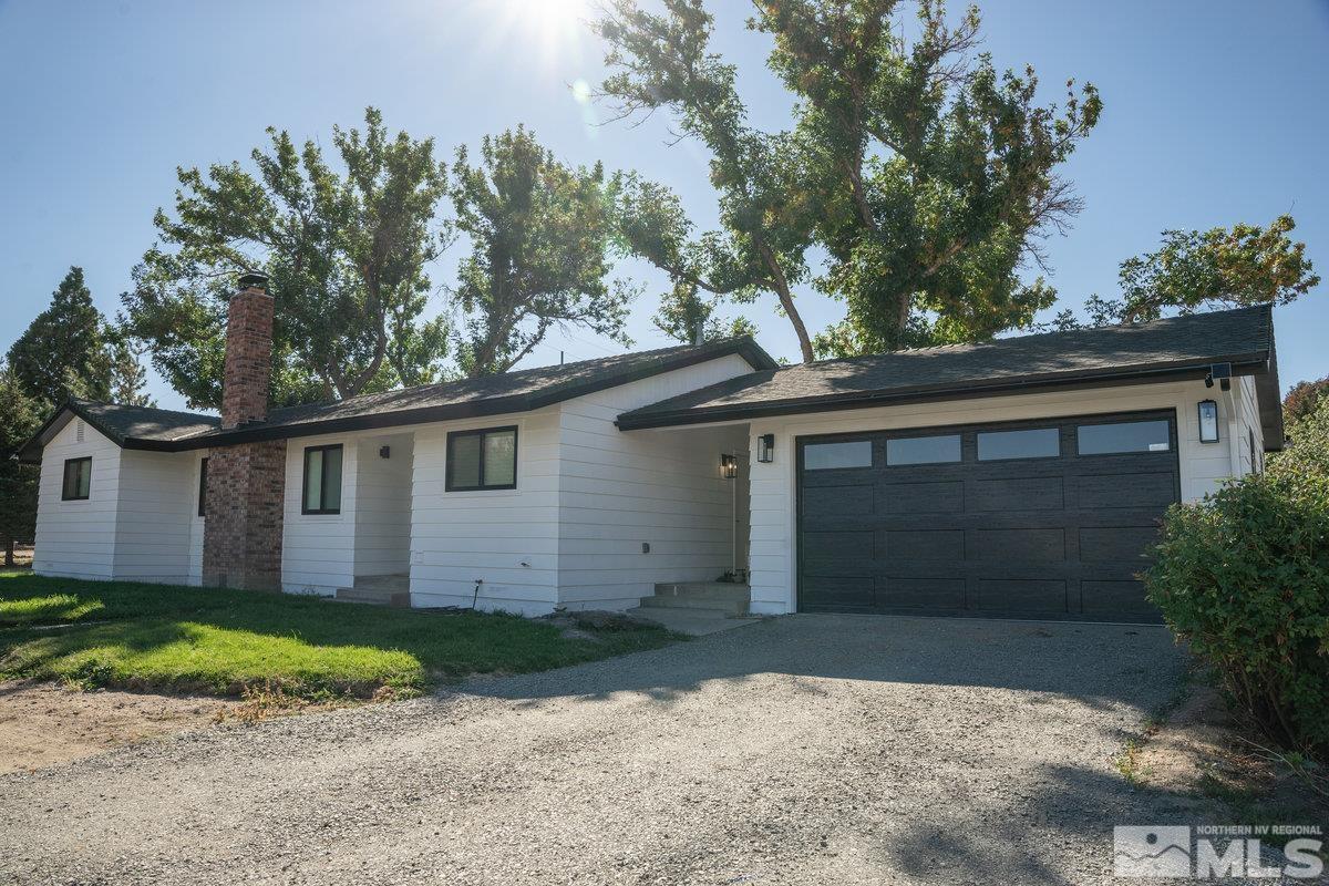 215 Neilson Road Reno, NV 89521 - Photo 28 of 40 front view of a house with a yard
