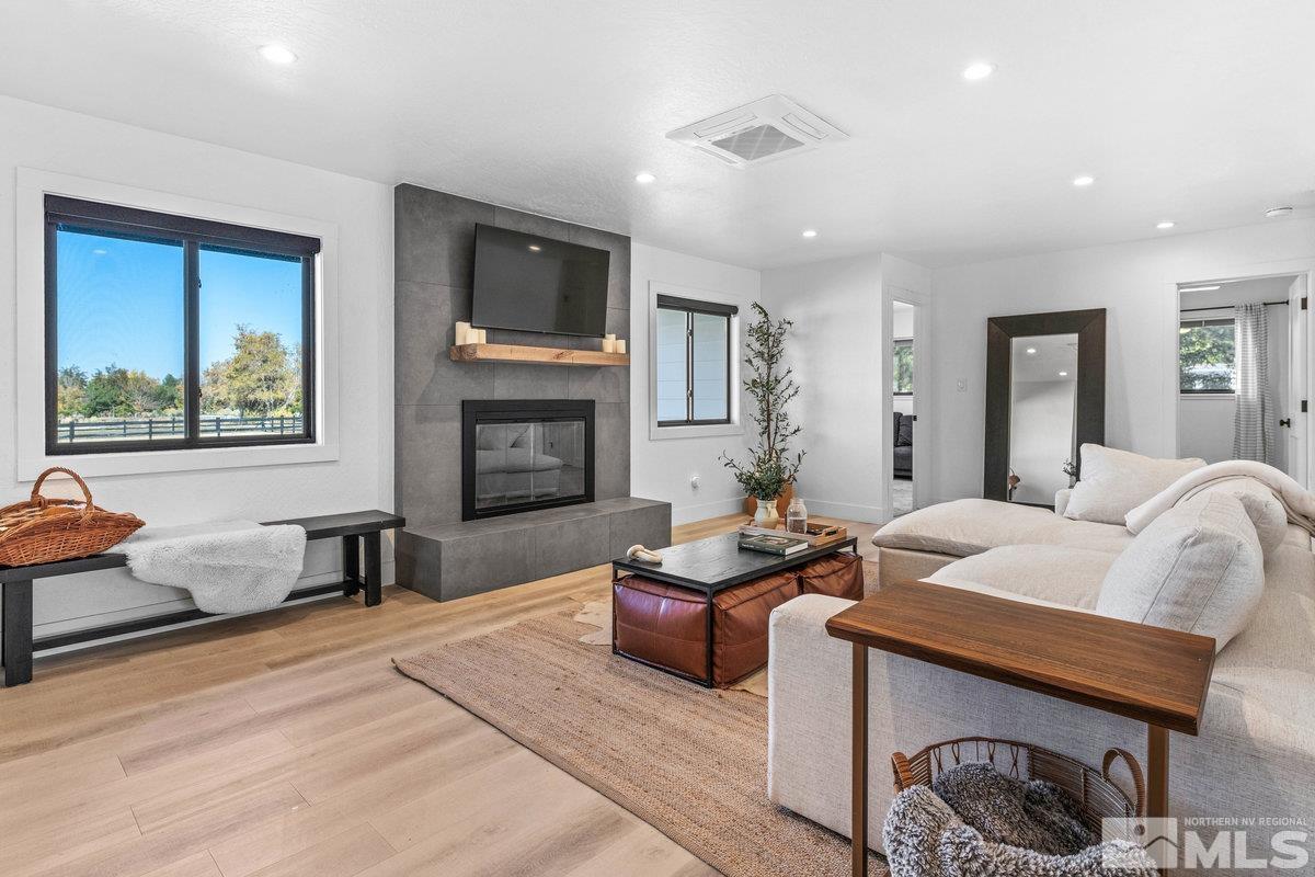 215 Neilson Road Reno, NV 89521 - Photo 3 of 40 a living room with furniture flat screen tv and a fireplace