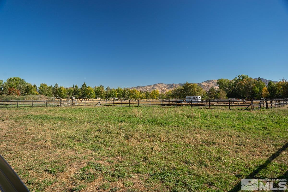 215 Neilson Road Reno, NV 89521 - Photo 31 of 40 a view of a lake with houses in the background