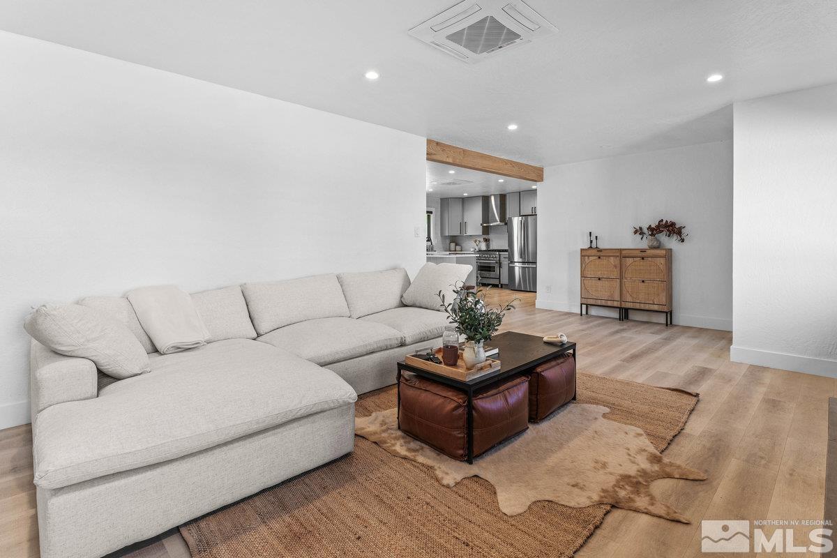 215 Neilson Road Reno, NV 89521 - Photo 5 of 40 a living room with furniture and a wooden floor
