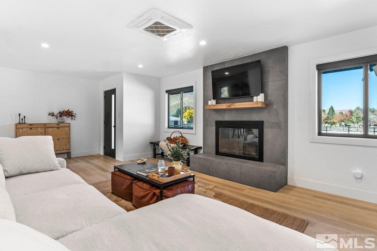 215 Neilson Road Reno, NV 89521 - Photo 6 of 40 a living room with furniture and a fireplace