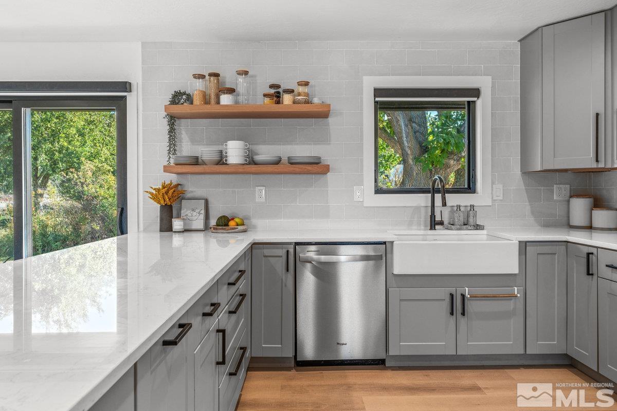 215 Neilson Road Reno, NV 89521 - Photo 7 of 40 a kitchen with sink cabinets and window