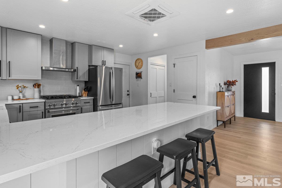 215 Neilson Road Reno, NV 89521 - Photo 10 of 40 a large kitchen with a table and chairs