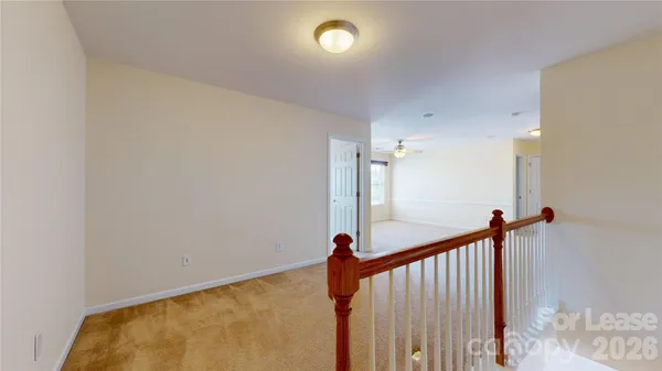 a view of a hallway view with staircase