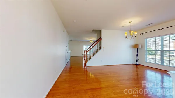 a view of an entryway with wooden floor