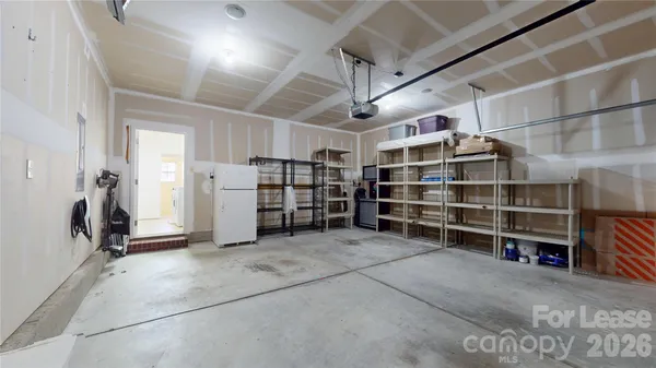 a view of walk in closet with empty shelves