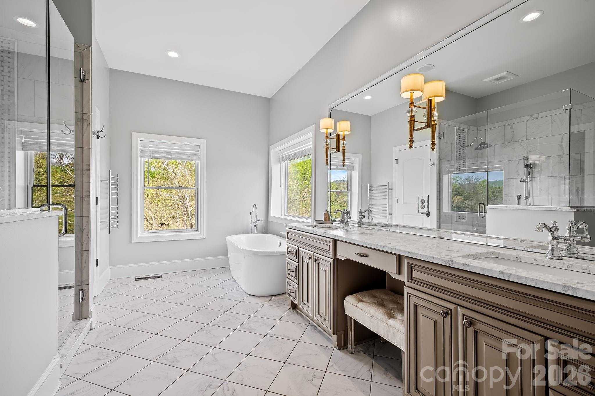64 Waterhill Way Fletcher, NC 28732 - Photo 17 of 48 a large bathroom with a double vanity sink a mirror and a bathtub