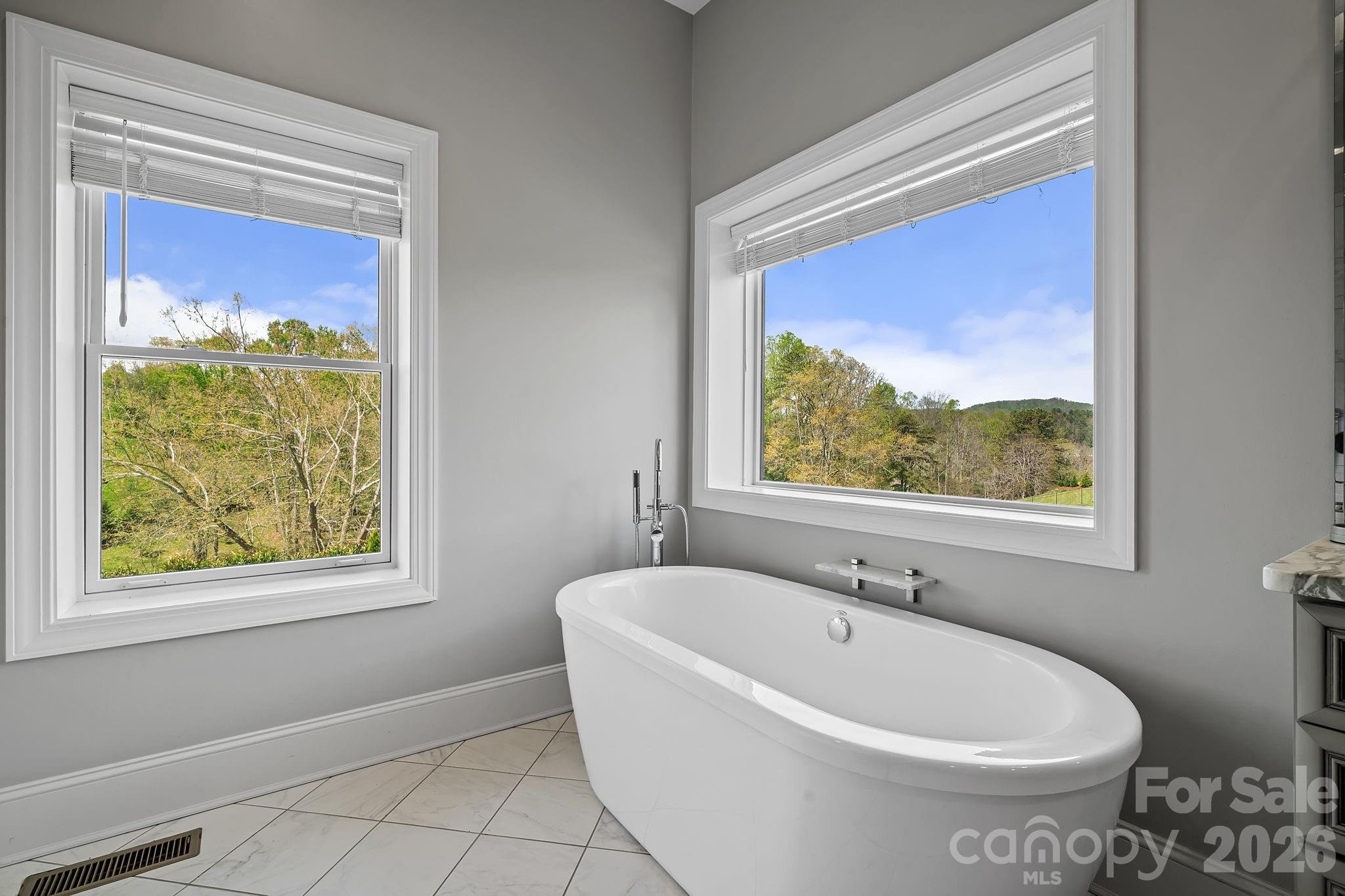 64 Waterhill Way Fletcher, NC 28732 - Photo 20 of 48 a white bath tub sitting next to a window