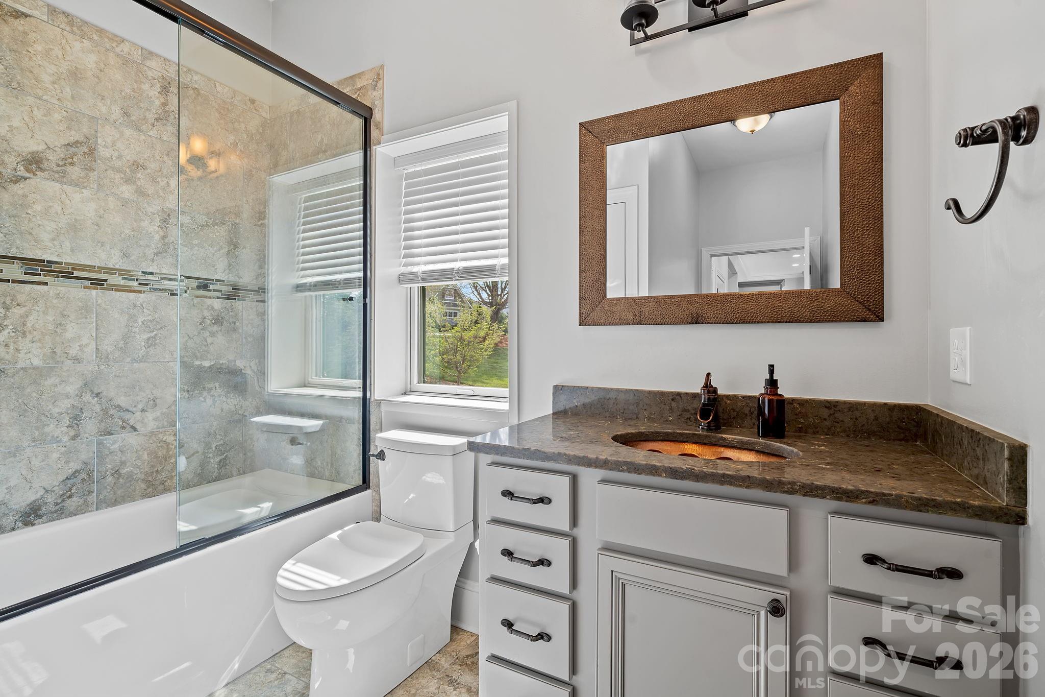 64 Waterhill Way Fletcher, NC 28732 - Photo 24 of 48 a bathroom with a granite countertop sink mirror vanity and toilet