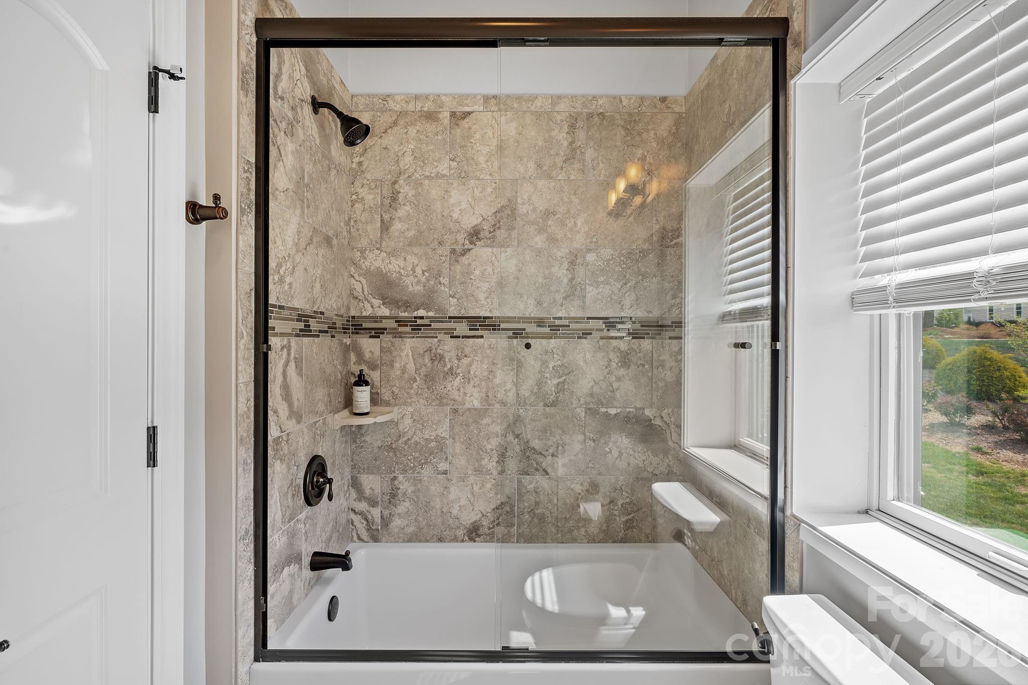 64 Waterhill Way Fletcher, NC 28732 - Photo 25 of 48 a view of a bathroom with a glass shower door