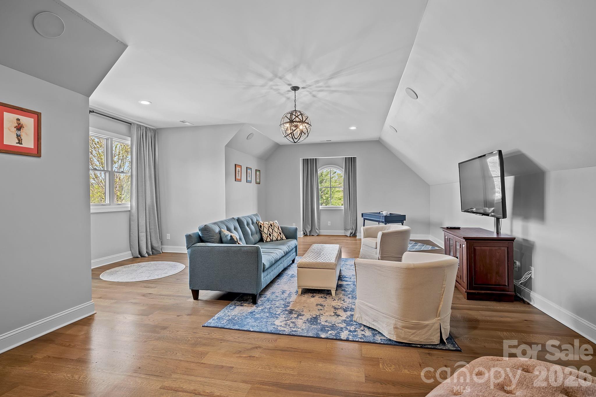 64 Waterhill Way Fletcher, NC 28732 - Photo 28 of 48 a living room with furniture a flat screen tv and a window