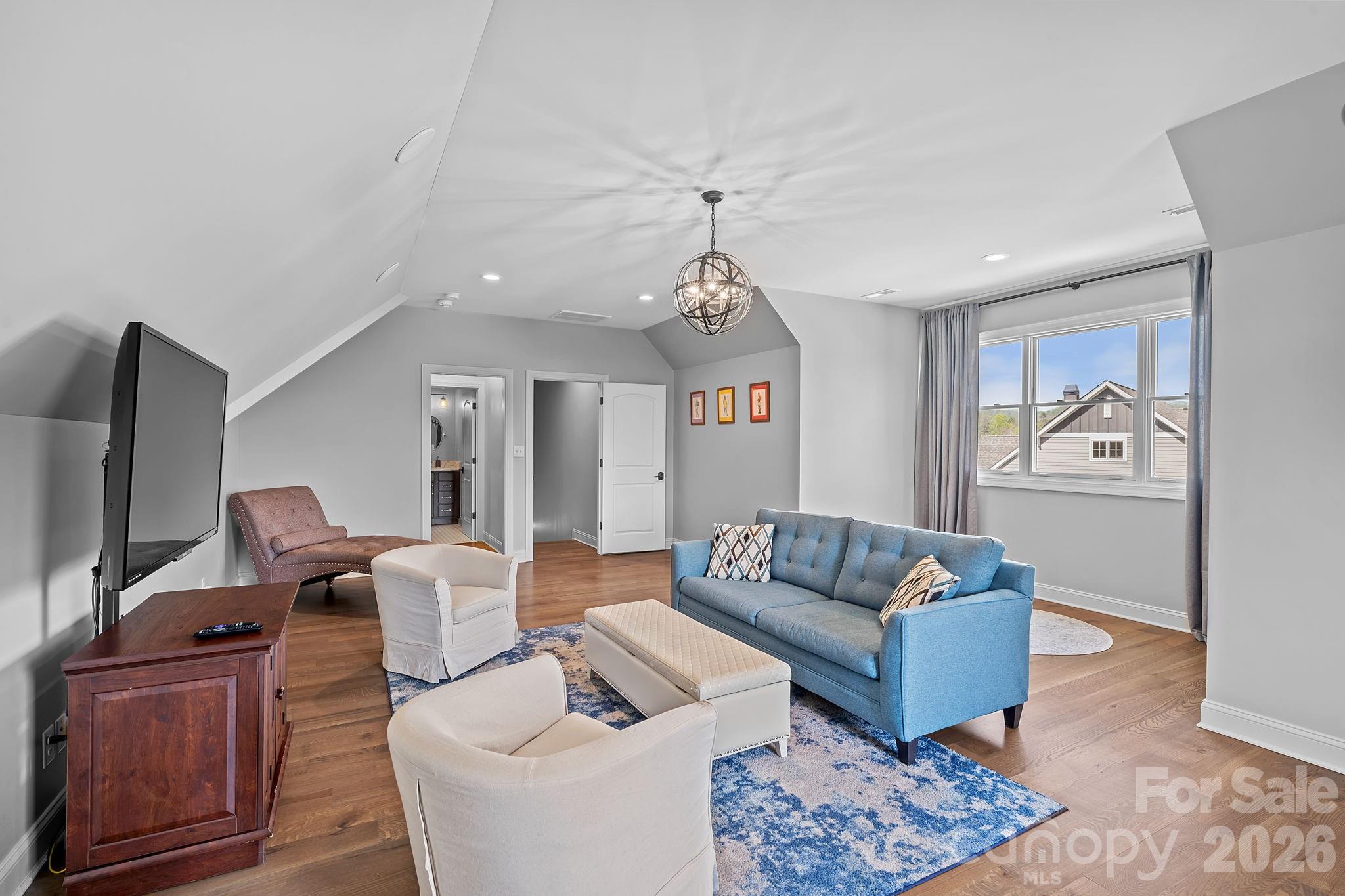 64 Waterhill Way Fletcher, NC 28732 - Photo 29 of 48 a living room with furniture ceiling fan and a rug