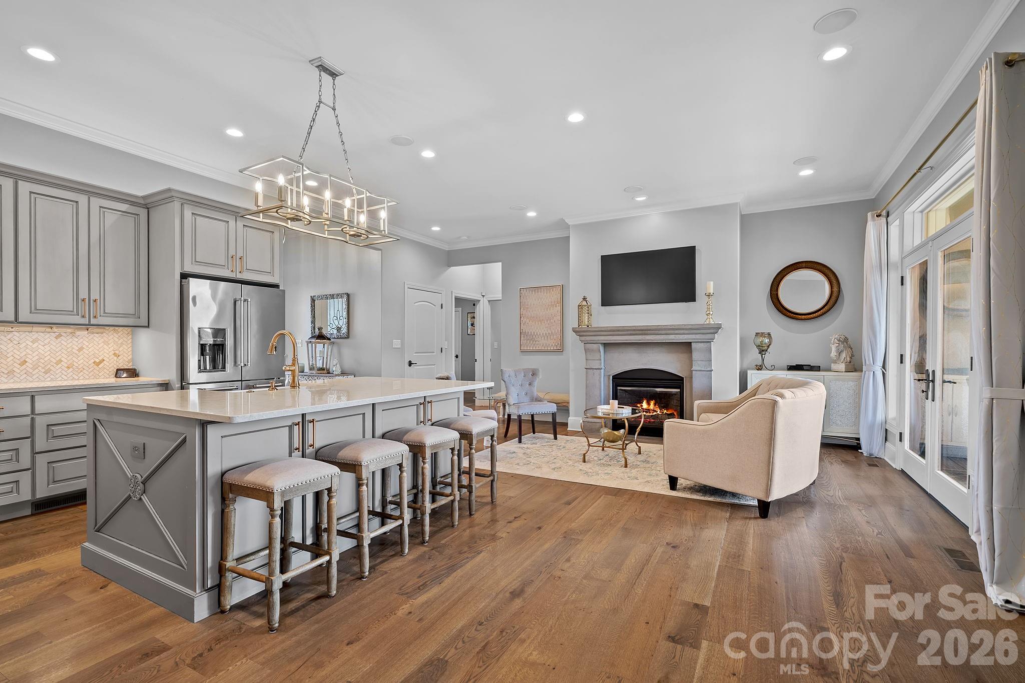 64 Waterhill Way Fletcher, NC 28732 - Photo 7 of 48 a living room with furniture a fireplace and a chandelier