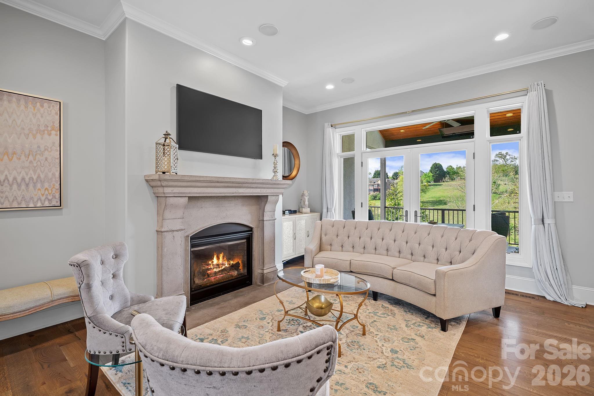 64 Waterhill Way Fletcher, NC 28732 - Photo 8 of 48 a living room with furniture and a fireplace