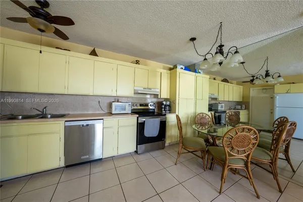 a kitchen with a sink cabinets and window