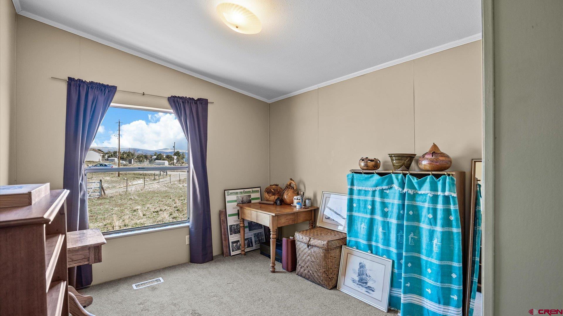 17177 Meadow Drive Cedaredge, CO 81413 - Photo 18 of 30 a living room with furniture and a window