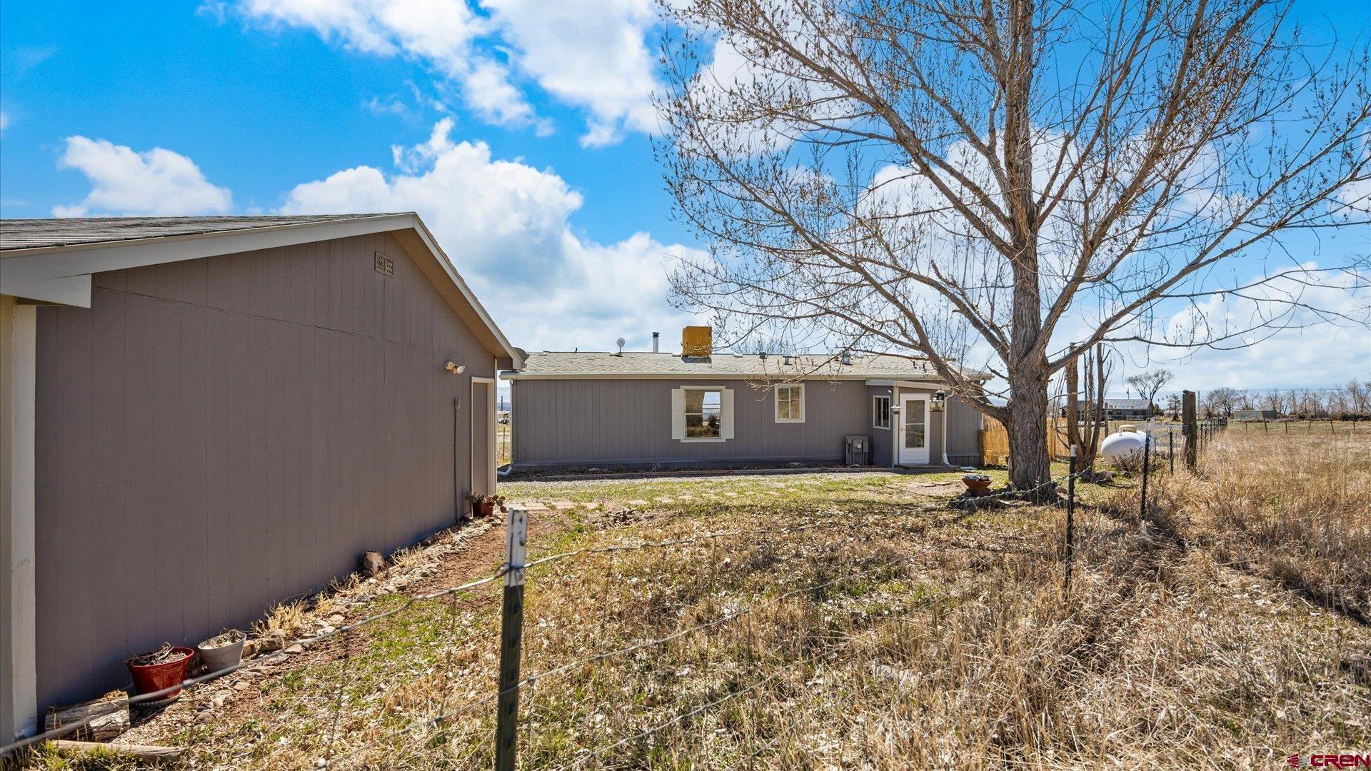 17177 Meadow Drive Cedaredge, CO 81413 - Photo 23 of 30 a house view with a yard
